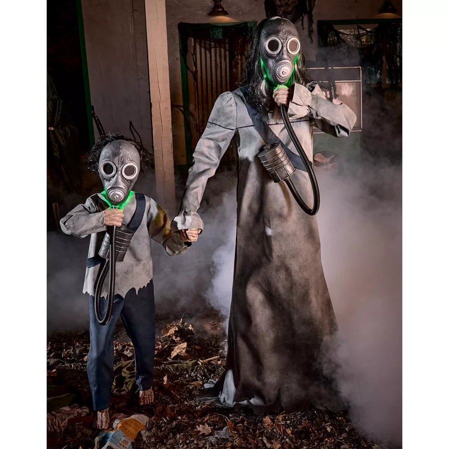 Set up in a dim room with haze drifting past, the green of both masks carrying in the dark
