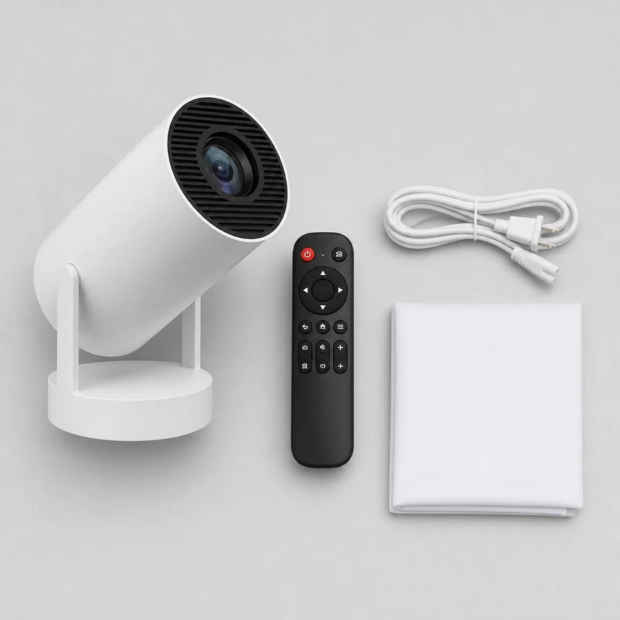 Overhead flat-lay of the projector, remote, cable and folded screen on pale paper
