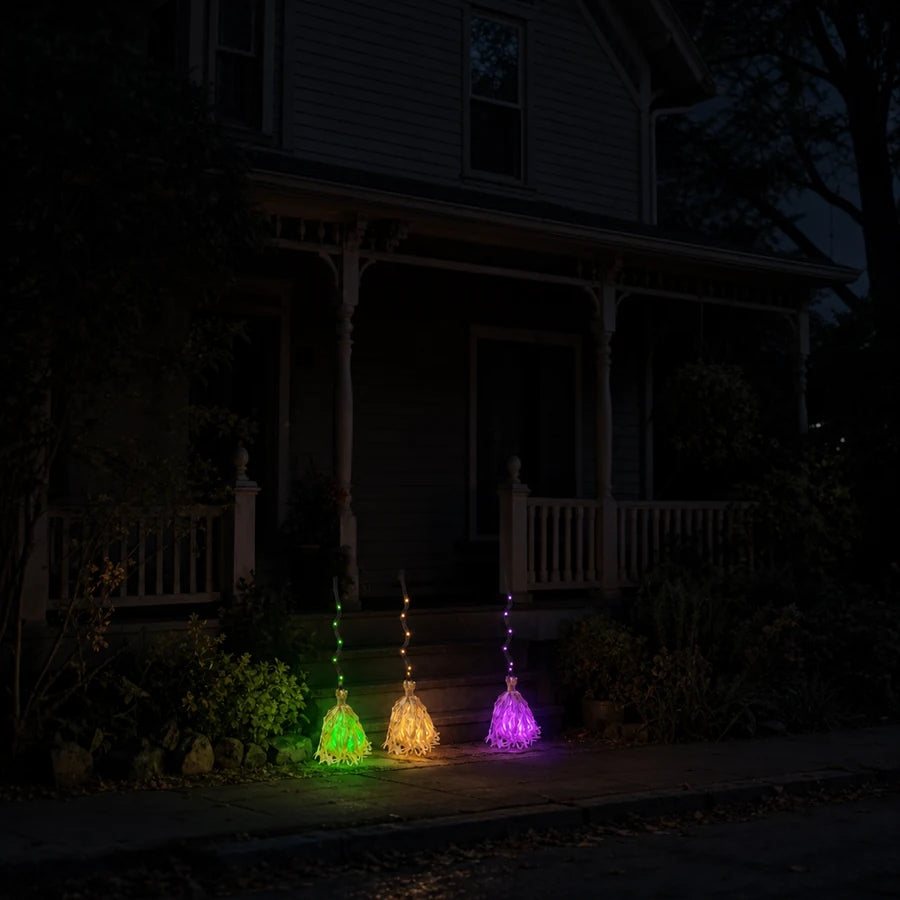 Seen from the sidewalk: three of them along the walk in green, amber and violet
