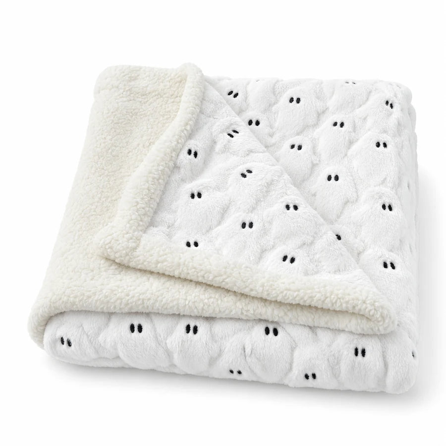 Two corners folded back showing the ghost-texture front and the plain sherpa back