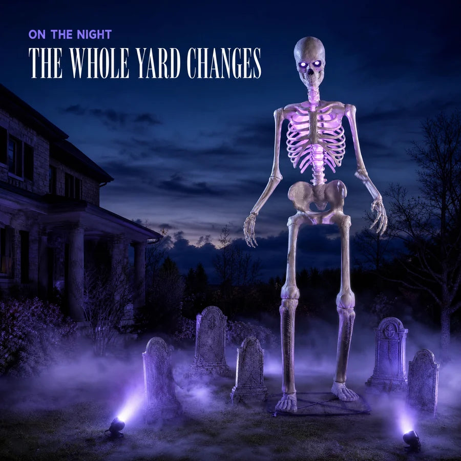 Standing among headstones in low violet fog, lit from below, on Halloween night