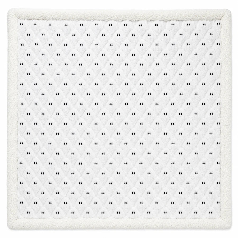 The throw fully unfolded from above, the repeating ghost pattern edge to edge