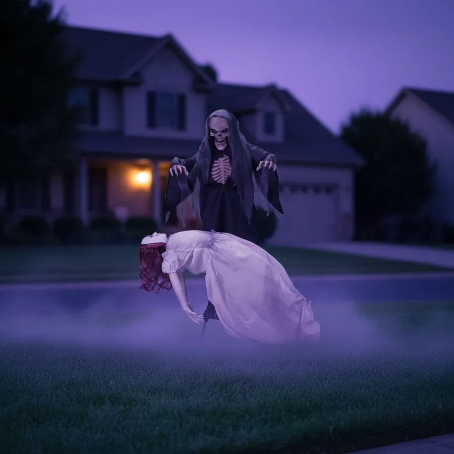 Hollowbrook 5.6 ft Reaper set up on a suburban front lawn at night, lit against the house