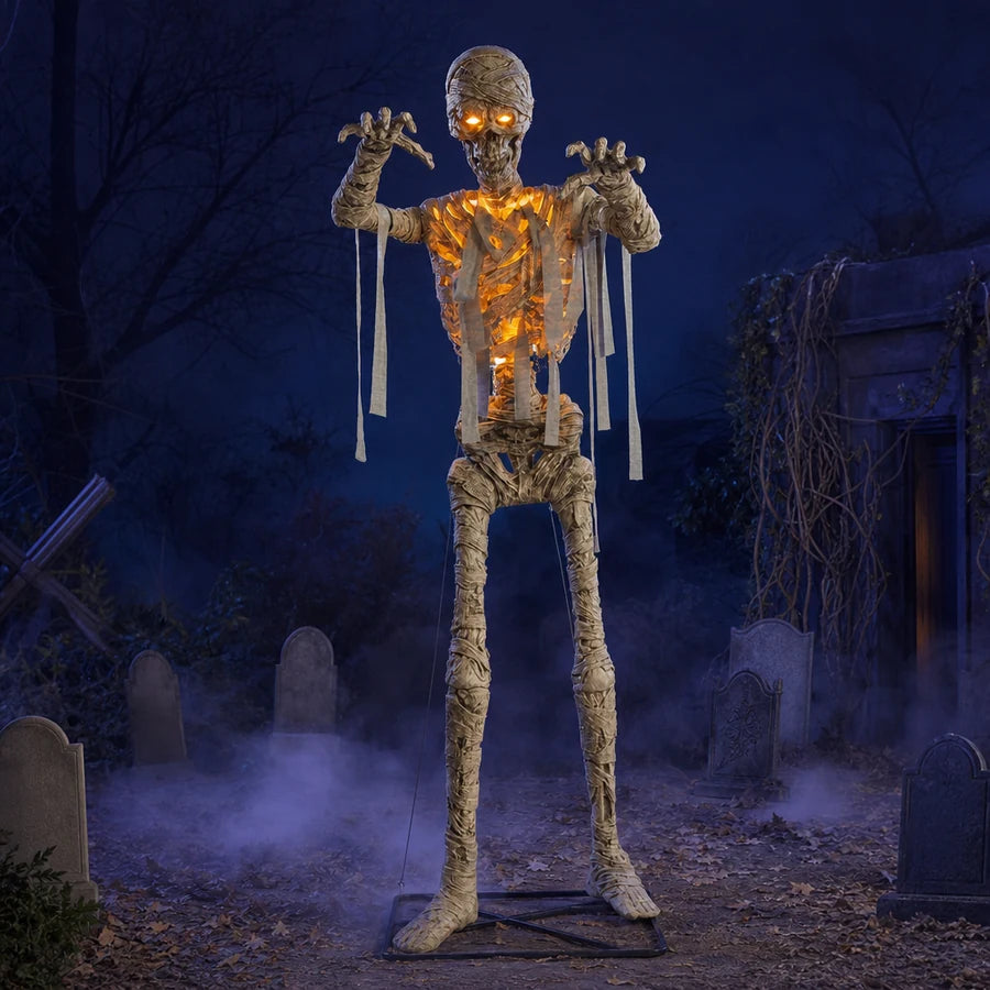 Wrackmoor 11 ft Mummy glowing amber in a foggy graveyard display at night, headstones nearby