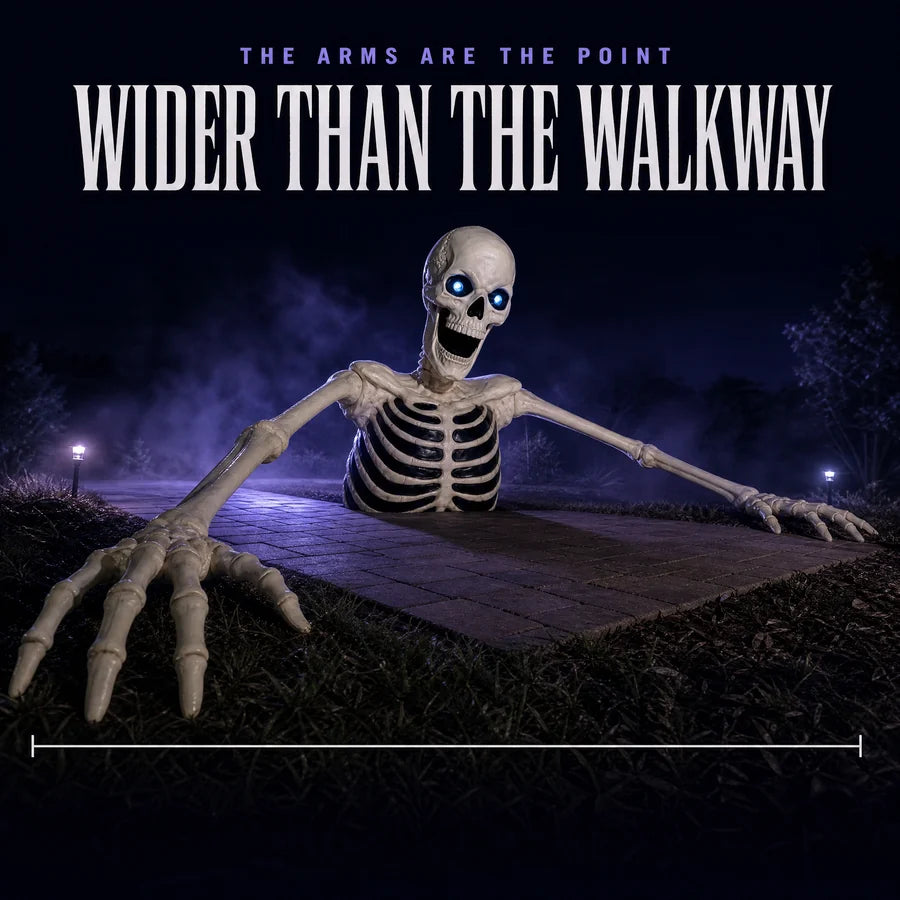Low night shot along the arms, both bony hands reaching past the edges of the walkway behind