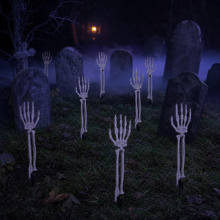 The arms around a headstone with a groundbreaker skeleton behind them at night