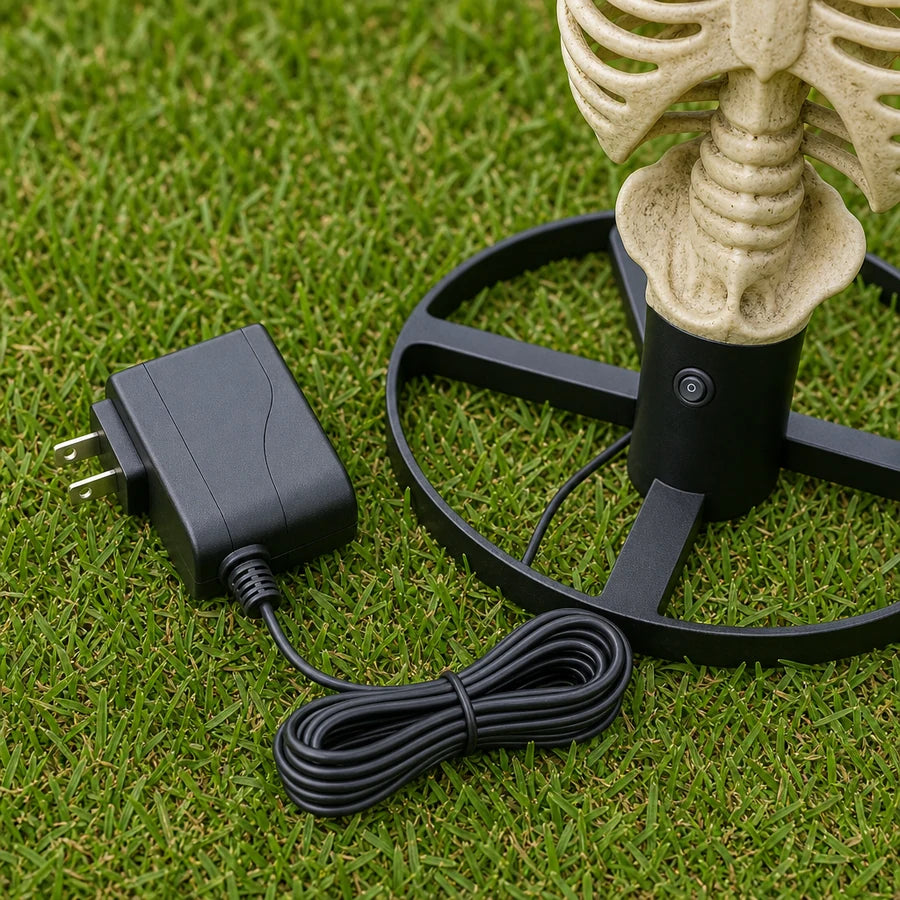 The plug-in power adapter and single power button at the base of the torso