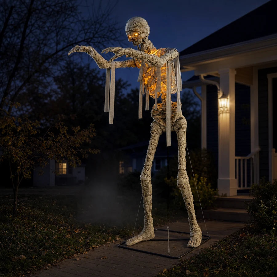 Wrackmoor 11 ft Mummy beside a front walkway at dusk, one arm reaching over the path