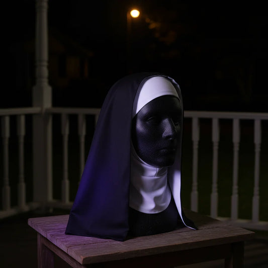 Sister Shadow Mask on a porch at night